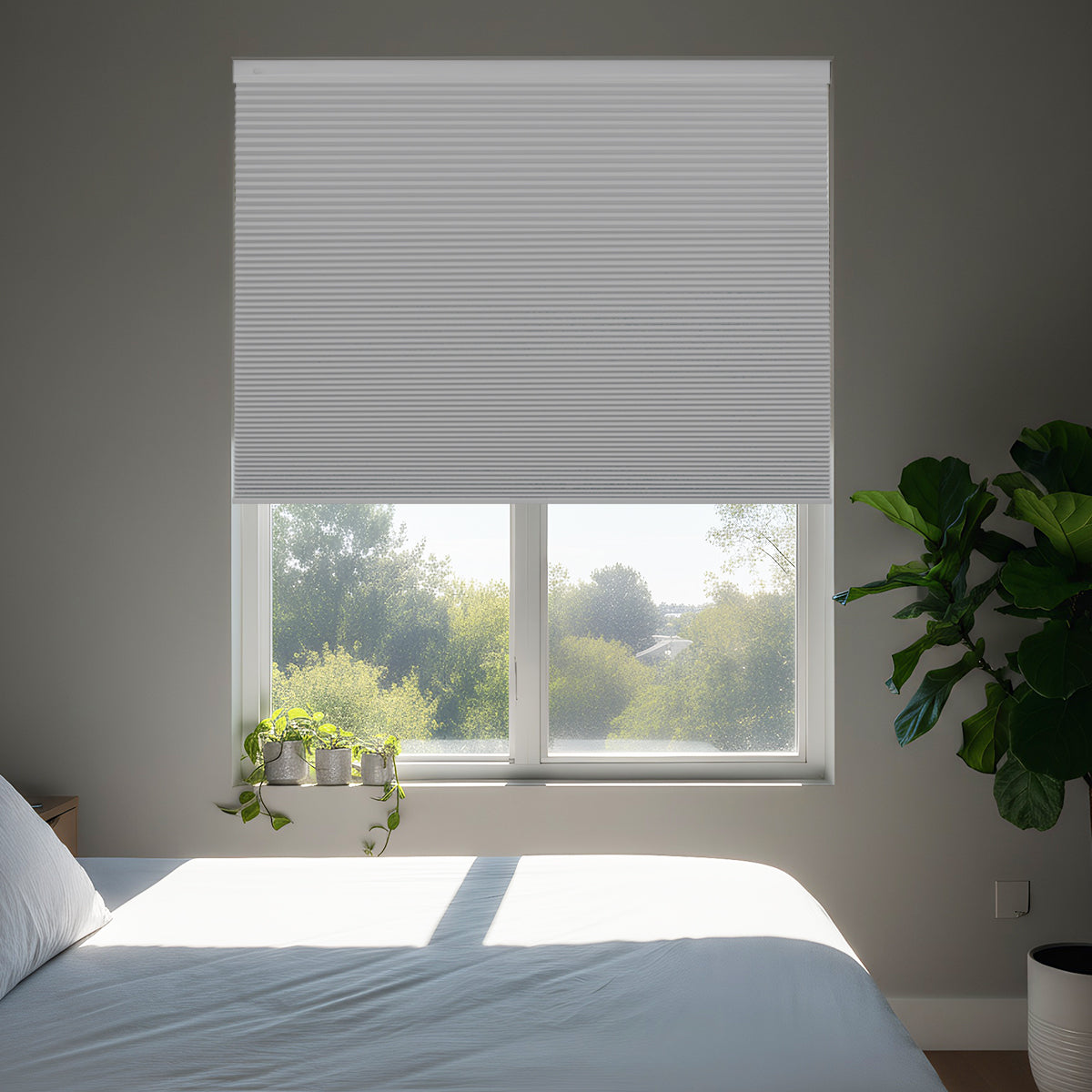 Cordless no-drill top down bottom up blackout honeycomb shades installed in bedroom, providing complete light blockage, privacy, and modern style