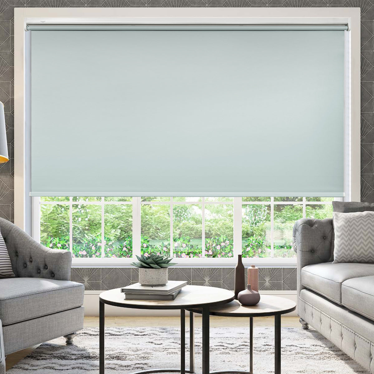 Cordless blackout roller shades partially lowered in modern living room