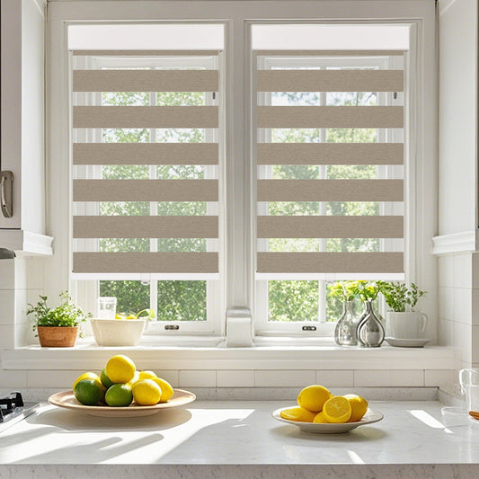 Cordless cassette zebra blinds in a modern kitchen, light filtering dual layer shades providing soft natural daylight and privacy.