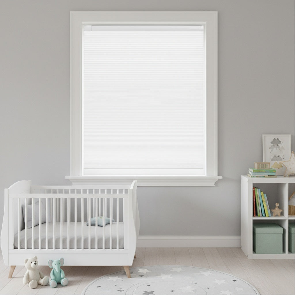No drill cordless light filtering honeycomb shades installed in a nursery providing soft daylight and child safe window coverage