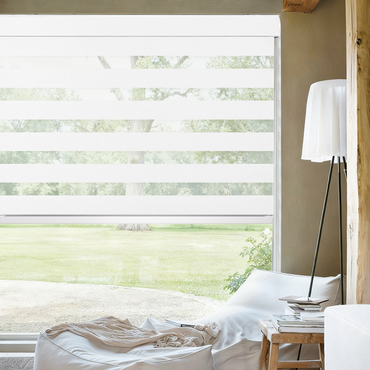 Custom remote control light filtering zebra blinds installed in a living room, dual layer window shades for soft natural light control and privacy.